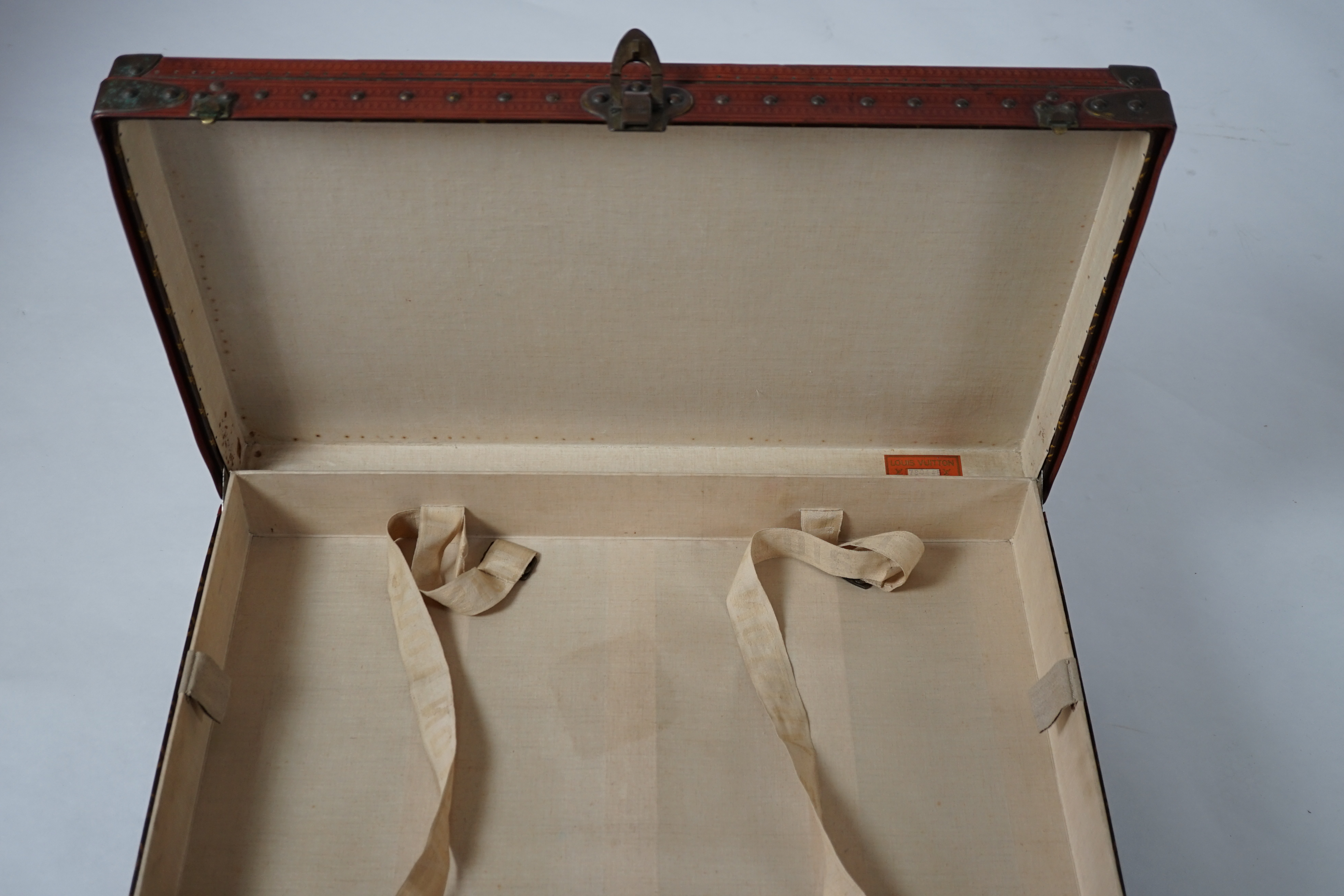 A vintage Louis Vuitton monogram canvas suitcase, 71cm x 44cm x 22cm